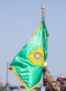 FB_IMG_1766253790195-218x300 AES : Remise de l’Étendard à la Force unifiée par le Général d’Armée Assimi GOÏTA